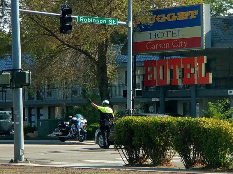 Photo by Brett Fisher. A CCSO motor officer performs traffic control Saturday morning at Robinson and Stewart streets.