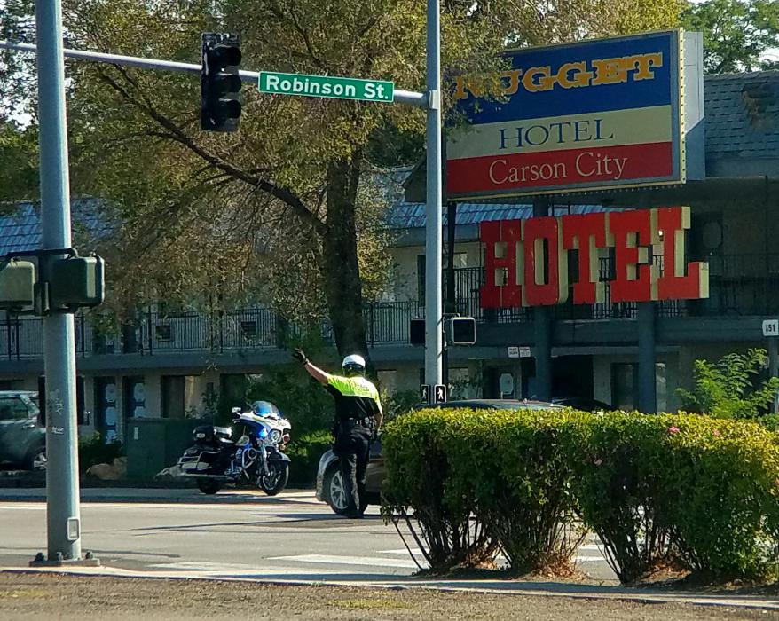 Photo by Brett Fisher. A CCSO motor officer performs traffic control Saturday morning at Robinson and Stewart streets.