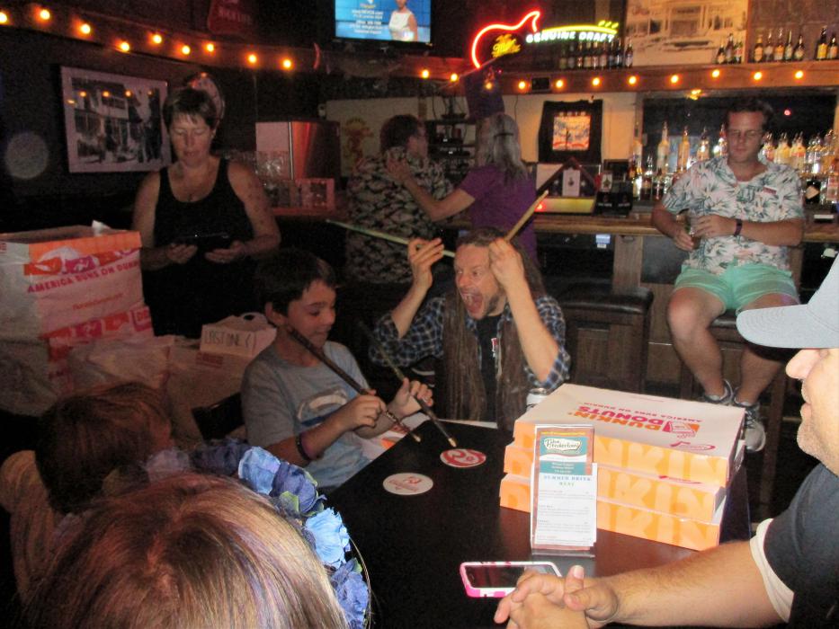 Photo by Isaiah Burrows. Ace Ratclaw of Rednex (right) horses around with a young fan.