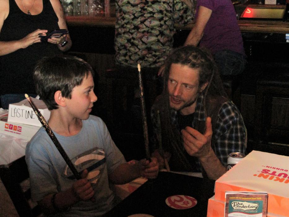 Photo by Isaiah Burrows. Ace Ratclaw of Rednex (right) talks to a young fan.