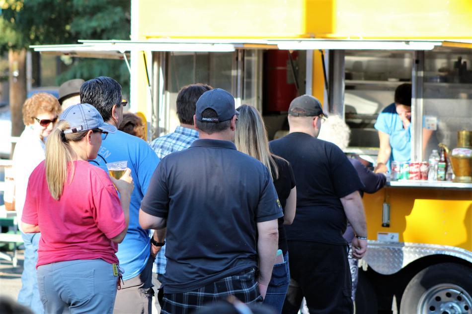 Diners line up to be fed by The Lazy Hog Wednesday at the BAC.