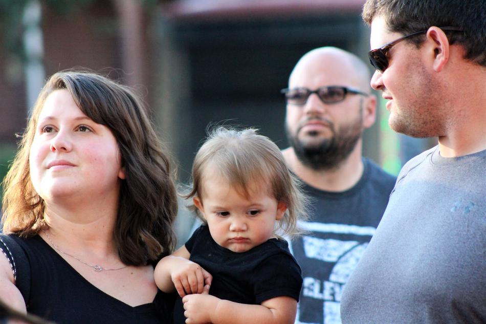 A young family checks out the menu of a food truck Wednesday evening at the BAC.