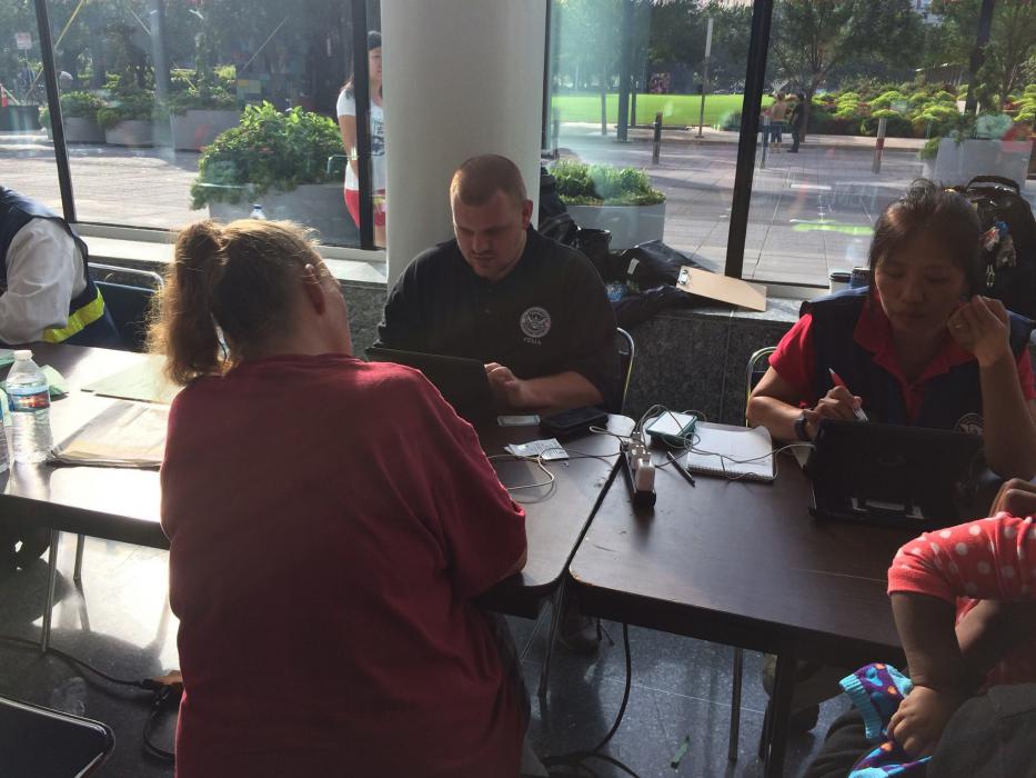 In this FEMA photo, survivors of Hurricane Harvey apply for aid. A telephone, online service center will open in Carson City.