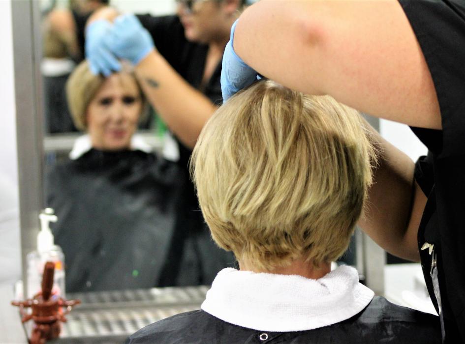Photos by Brett Fisher. Jesika Yochum gets her hair colored Thursday.