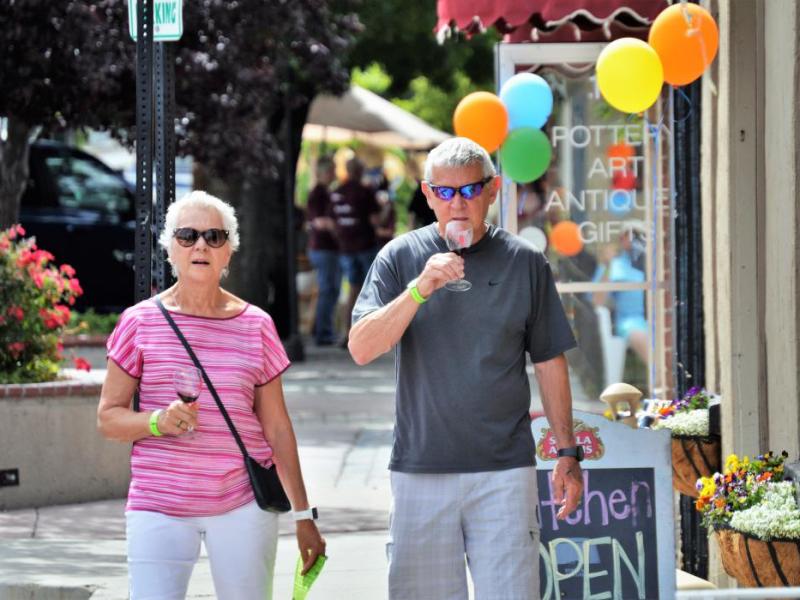 Photo by Brett Fisher. A couple participates in downtown Carson City's monthly Wine Walk.