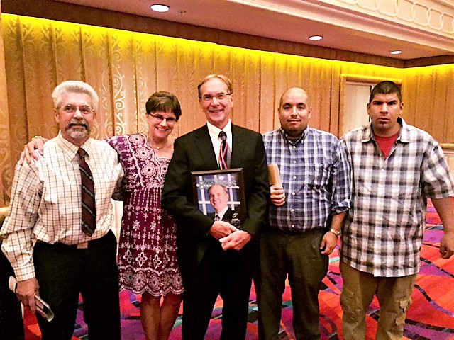 Ed Epperson (center) with his Lifetime Achievement Award, photo courtesy Carson Tahoe Health.