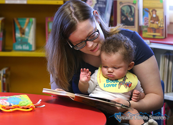 Kim Thomas reads to her 5-month-old son Javon at the Browsers Corner Book Store. Cathleen Allison, Nevada Photo Source