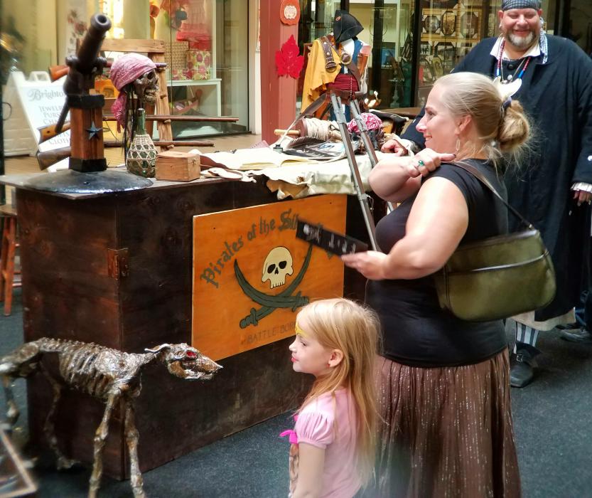 Visitors at the pirate encampment inside the Carson Mall Saturday.