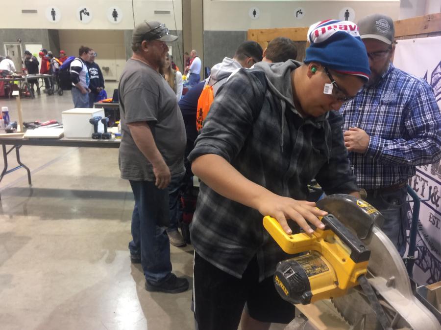 Sebastian using a table saw to build a box