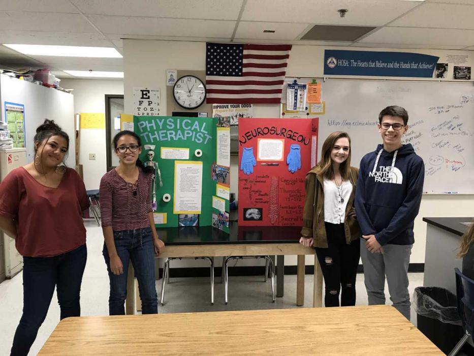 2nd place winners Xitlali Vega Alvarez & Gabriela Fernandez Lopez with their health career display board on a physical therapy.
