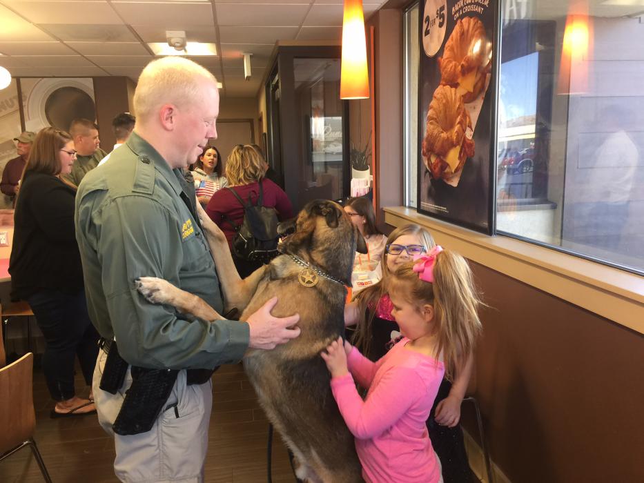 CCSO Deputy Darrin Riggin, K-9 Tarzan with Alyssa Fry, 7 and Lilly Trotter, 5.