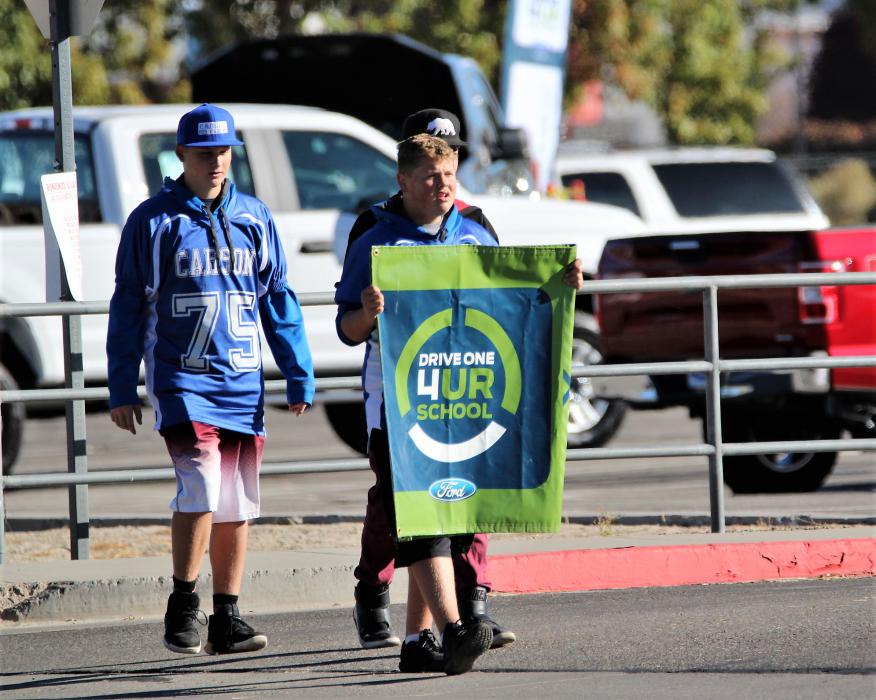 Photos by Brett Fisher. Football players draw traffic into Carson High School for the 