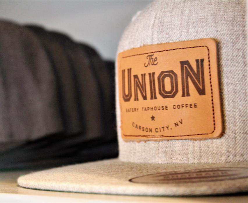 A Union Carson baseball cap on display near the front register.