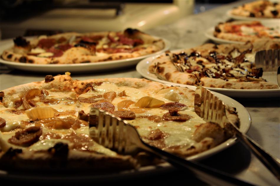 Pizza fresh out of the brick oven.