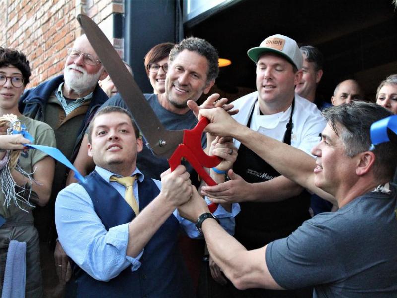 Photos by Brett Fisher. Nick Meyer (left), Mark Trujillo, Tommy Linnett and Mark Estee (right) cut the ribbon Thursday.