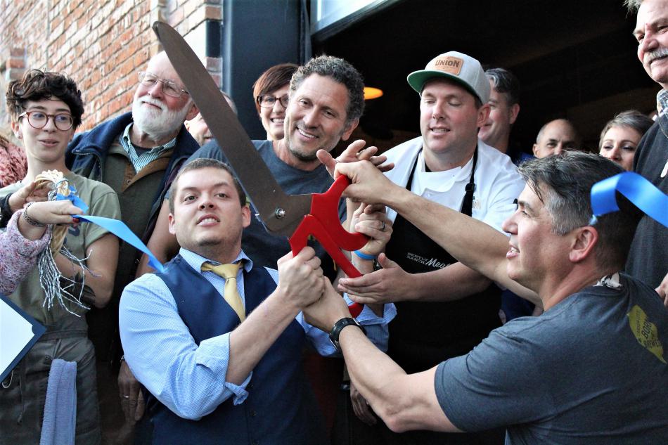 Photos by Brett Fisher. Nick Meyer (left), Mark Trujillo, Tommy Linnett and Mark Estee (right) cut the ribbon Thursday.