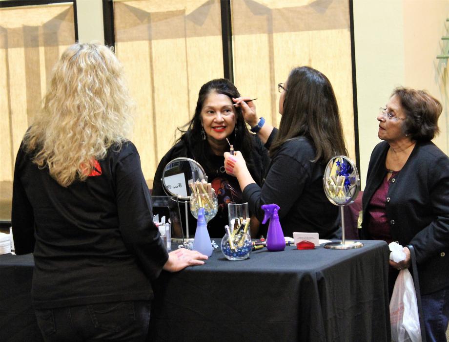 Photos by Brett Fisher. A woman gets a makeover demonstration Friday night at the Nevada Women's Expo inside the Carson Mall.