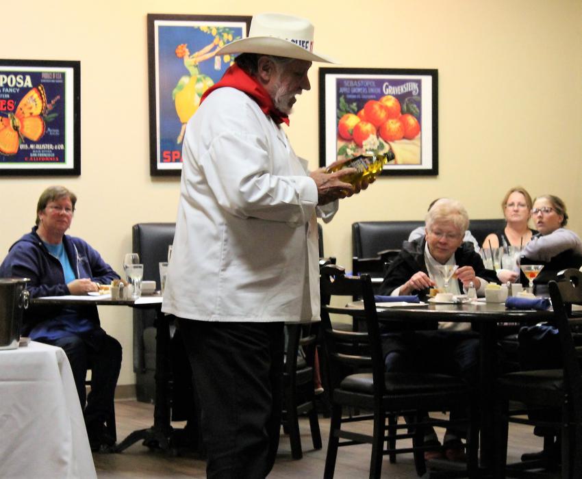 Chef Don Pepe talks olive oil to guests at his Saturday show.