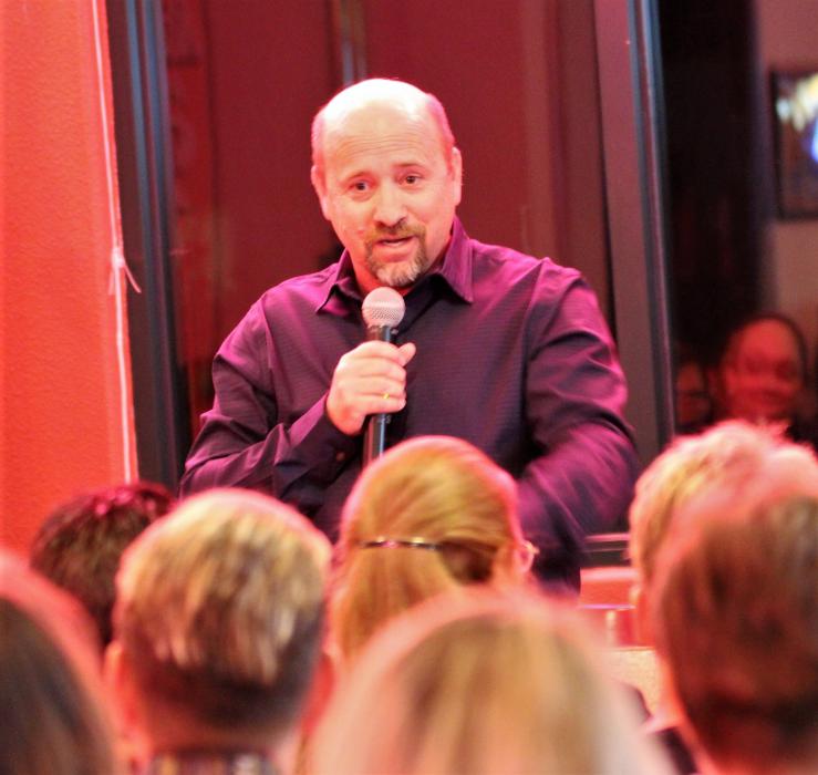 Comedian Bob Johnston delivers a punch line to Friday night's audience.