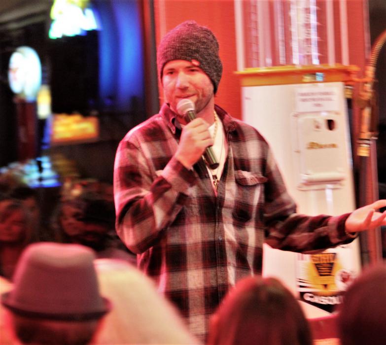 Comedian Ethan Pickett jokes around with Friday night's audience.