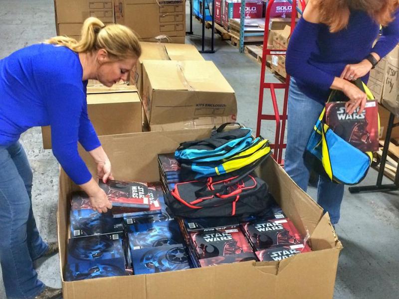 Carson City School District employees fill backpacks to send to students statewide