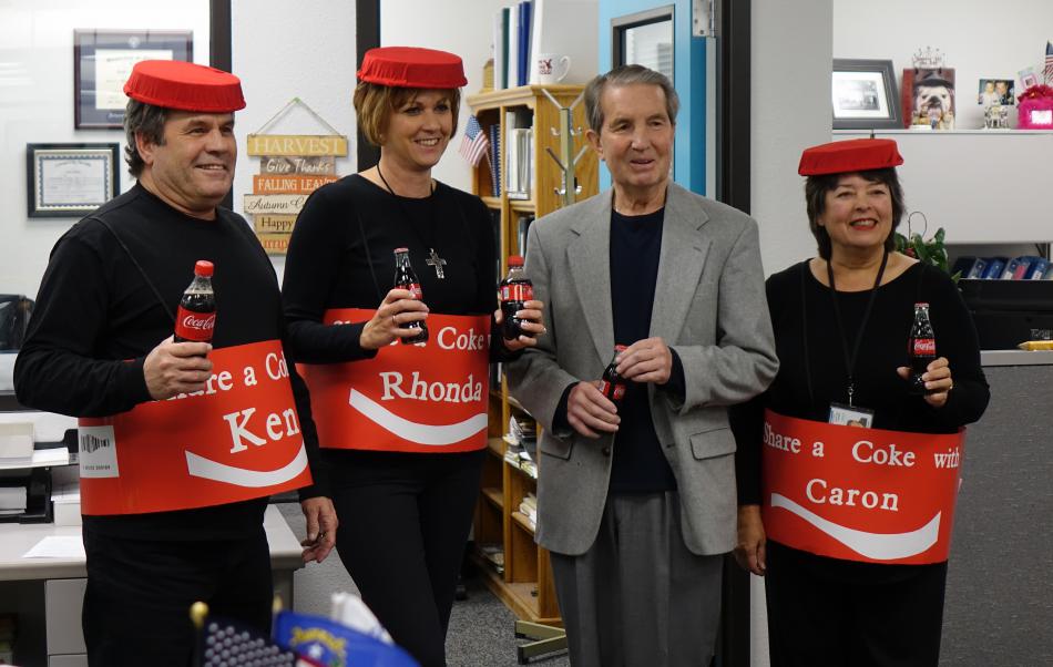 Mayor Bob Crowell receives a soda from Ken Shannon, Rhonda Price, and Caron Machado of the Carson City Assessor's Office