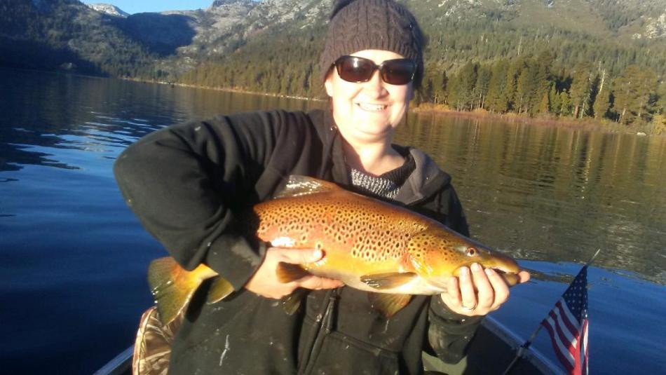 Tabitha Tripp with her catch near Emerald Bay at Lake Tahoe.