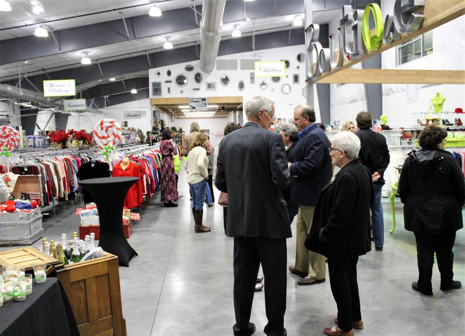 Guests mingle inside the all-new Classy Seconds Thrift Store in East Carson City.