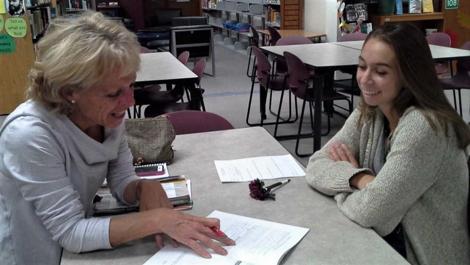 CHS Senior Chloe Hataway working on his Senior Project with Carson Animal Services Initiative Chair Lisa Schuette.