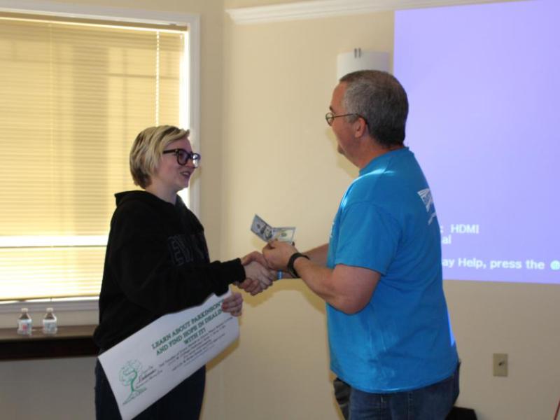 Brian Reedy shares Alex Camp's winning logo with the Carson City Parkinson’s Advocacy & Awareness support group.