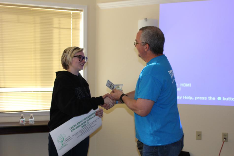 Brian Reedy shares Alex Camp's winning logo with the Carson City Parkinson’s Advocacy & Awareness support group.