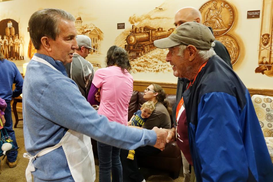 Mayor Bob Crowell greeting Terry Hogan, 79: Finished 10th in Turkey Trot 8k