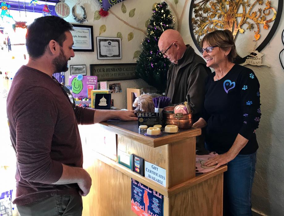 Stan and Sue Jones ring up a customer at Purple Avocado
