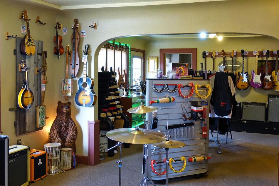 Play Your Own Music's walls are lined with stringed instruments in the main showroom