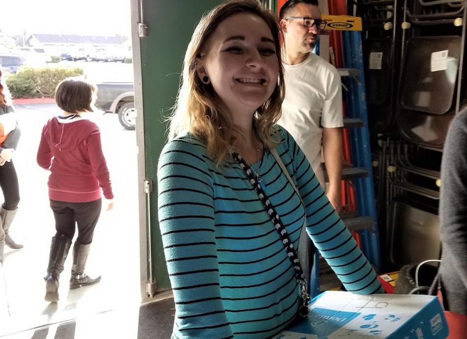 CHS Junior and NHS member Ivie Tims delivering a Thanksgiving Food Drive box.