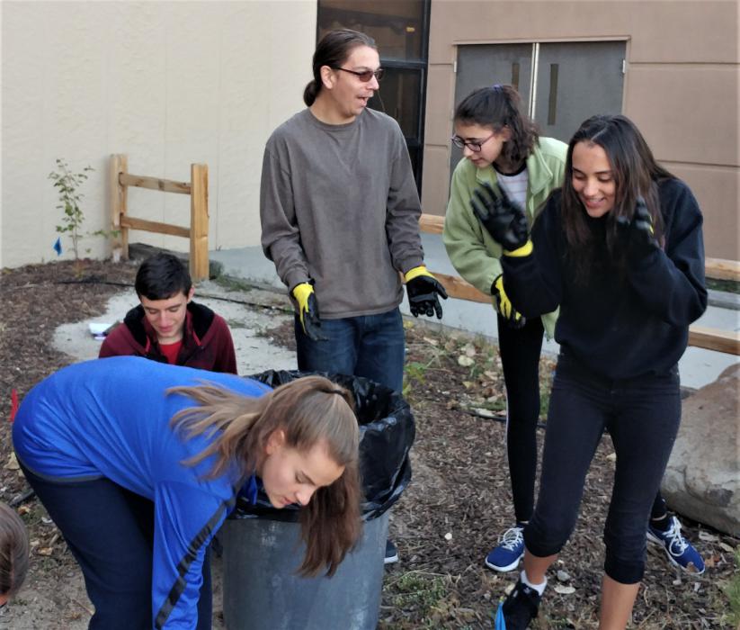 CHS Honors Biology students interacting with their garden.