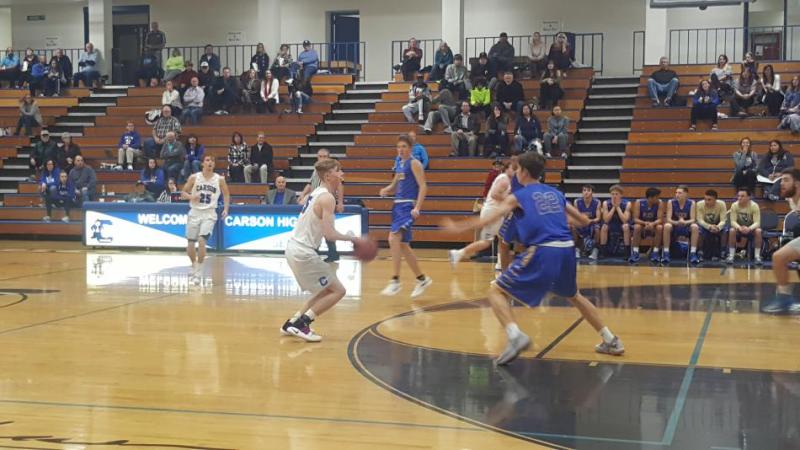 Senior guard Johnny Randle pulls-up for 3 during the first quarter