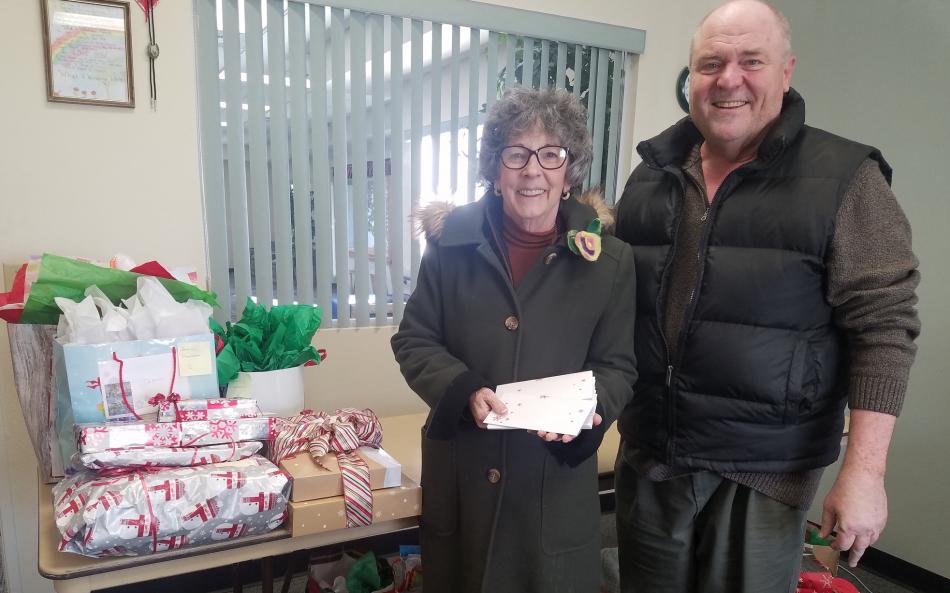 Barbara Singer of Vidler Water Company presents Warren Bottino, program manager for Meals on Wheels at the Senior Center.