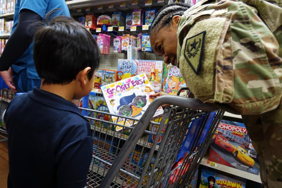 Army National Guardswoman Sgt. 1st Class Tresa Currie with her shopping partner
