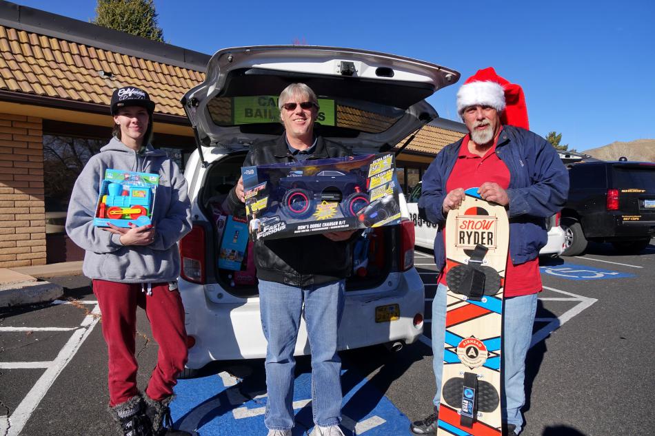 From left: Teslah Cunningham, Barry Lawless, Mark Shefler unloading their cab cars at Ron Wood Center