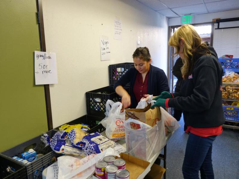 Erika Lera (right) helps with filling a basket
