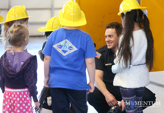 Firefighter/Paramedic Garrett Hekhuis talks to kids during Carson City Library’s Storytime at the CCFD Thursday, Dec. 28.