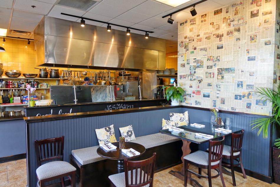 A view of the open kitchen and entryway.