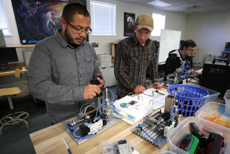 Applied Industrial Technology students Arturo Martell and James Butts work in the Industrial Technology Lab at WNC.