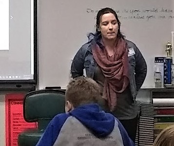 Graduate and guest speaker Krysta Scripter, now a published writer and photographer, talking with freshman and seniors.