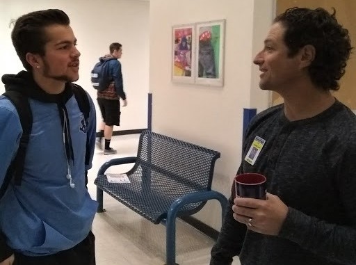 CHS teacher Ty McMillen talking with student Zach Glanzman during the Mob the Halls morning.
