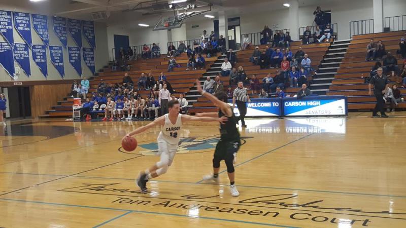 Center Trent Robison brings the ball up the floor.