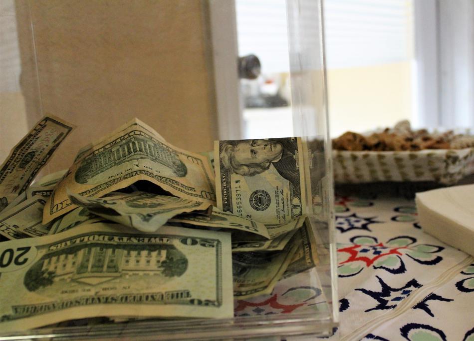 The donation jar inside A New U Salon and Spa.