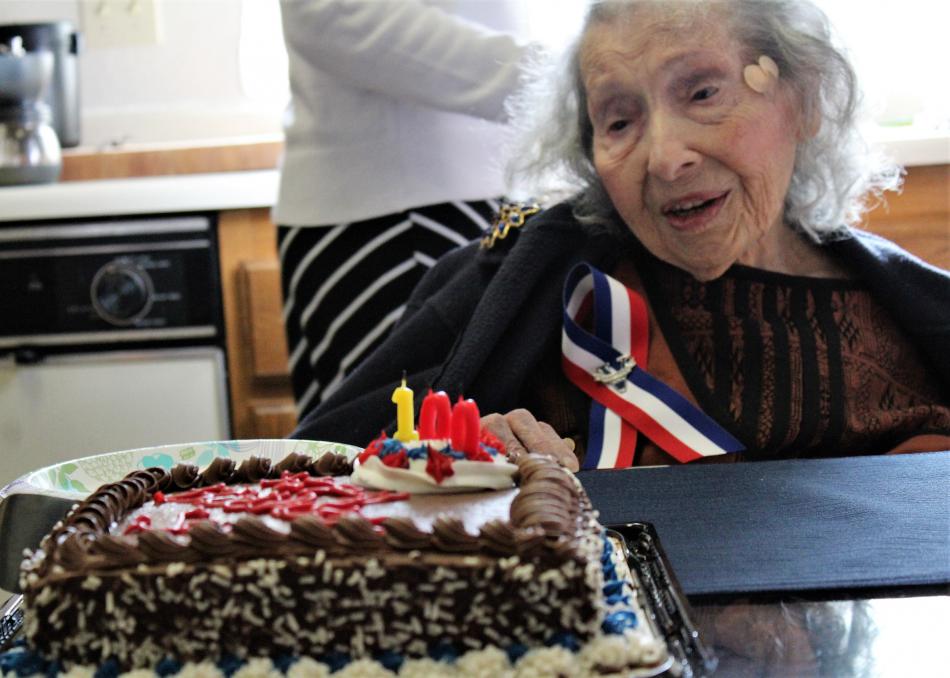 Sarah Boogay Garcia with her 100th birthday cake Saturday.
