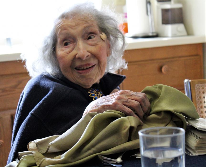 Sara holds a handkerchief fashioned out of a combat parachute used during WWII.